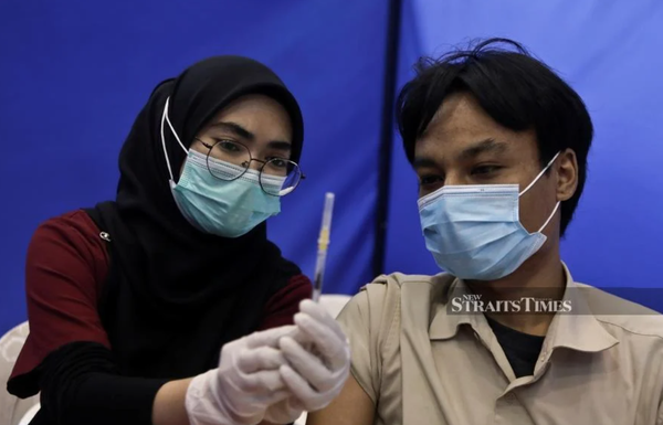 Almost 100 per cent of Malaysia's adult population vaccinated against COVID-19